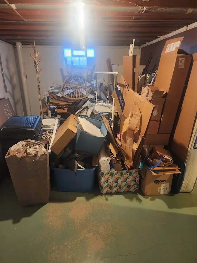 Roll-off dumpster container at job site for 2 Yard Dumpster Rental in Highland Park